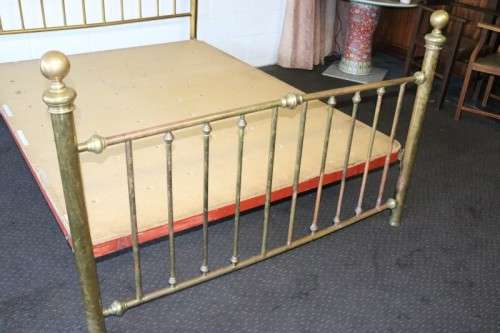 An amazing vintage Queen-size brass bed with a stunning brass headboard and footboard.RS17Bed