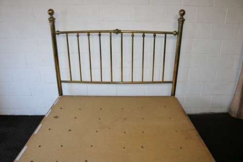 An amazing vintage Queen-size brass bed with a stunning brass headboard and footboard.RS17Bed