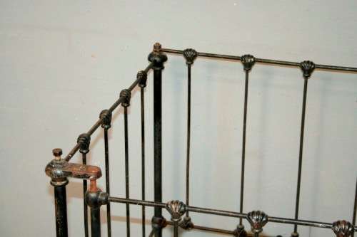 A stunning & rare antique (late 1800's) wrought iron baby's cot w/ dropside on its original castors