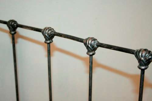 A stunning & rare antique (late 1800's) wrought iron baby's cot w/ dropside on its original castors
