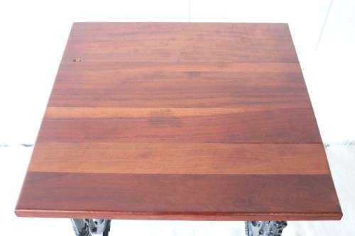 An amazing vintage cast iron sewing table with a wooden top - well made and very heavy!
