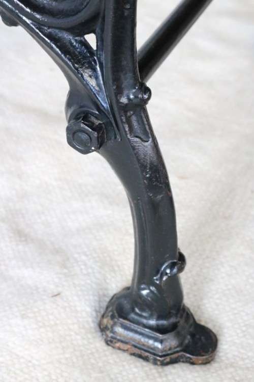 An amazing vintage cast iron sewing table with a wooden top - well made and very heavy!
