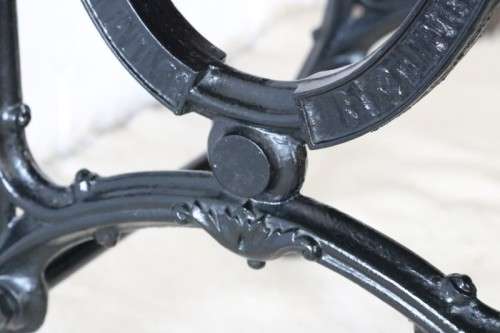 An amazing vintage cast iron sewing table with a wooden top - well made and very heavy!