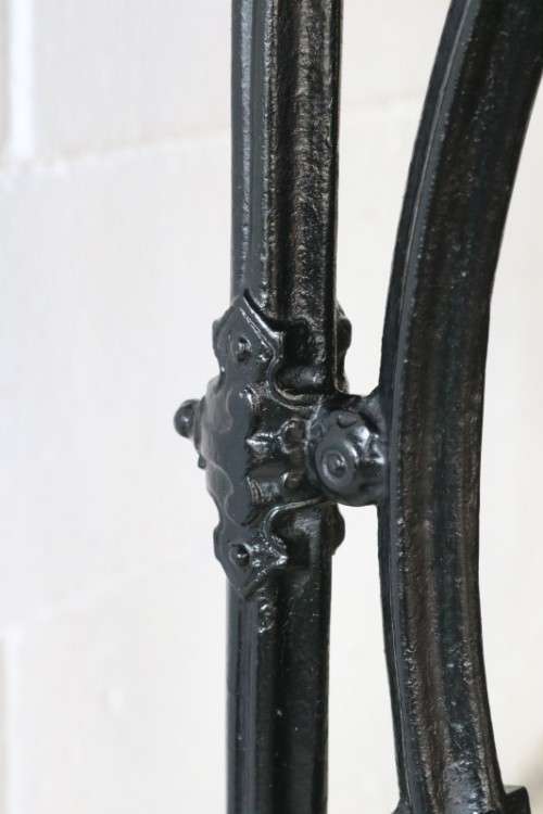 An amazing vintage cast iron sewing table with a wooden top - well made and very heavy!
