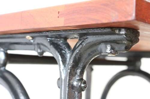 An amazing vintage cast iron sewing table with a wooden top - well made and very heavy!