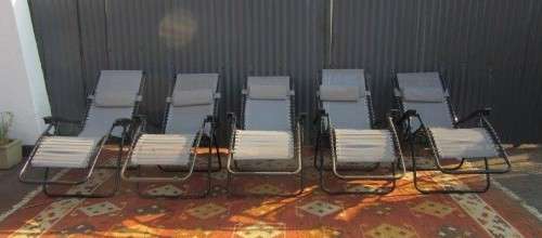 Five stunning metal and mesh reclining outdoor pool loungers in great condition - price/recliner