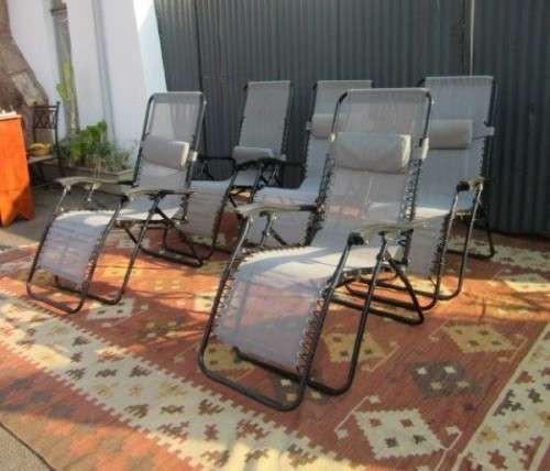 Five stunning metal and mesh reclining outdoor pool loungers in great condition - price/recliner