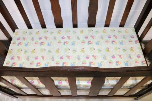 An awesome vintage solid Imbuia baby's cot on its original castors - perfect for nursery