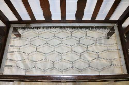 An awesome vintage solid Imbuia baby's cot on its original castors - perfect for nursery