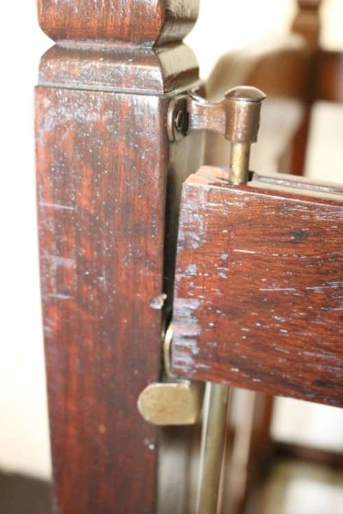An awesome vintage solid Imbuia baby's cot on its original castors - perfect for nursery