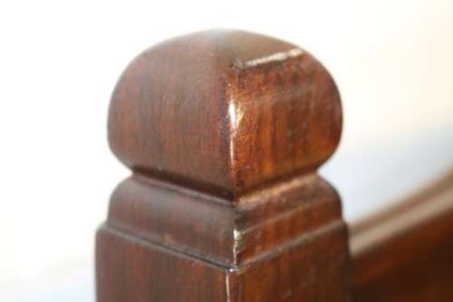 An awesome vintage solid Imbuia baby's cot on its original castors - perfect for nursery