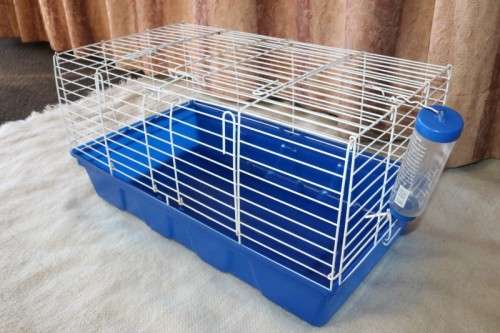 A well made plastic and steel pet (bunny, hamster etc) cage with an auto water dispenser