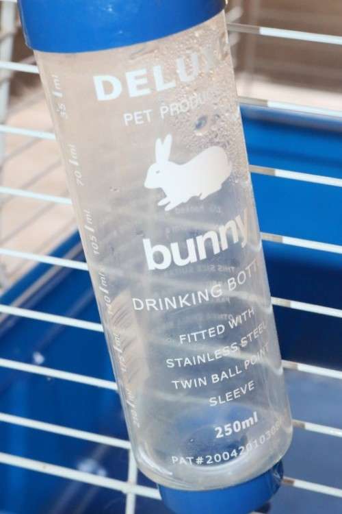 A well made plastic and steel pet (bunny, hamster etc) cage with an auto water dispenser
