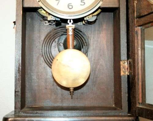 A beautiful vintage mechanical wall clock with a cut glass door and spiral gong in lovely condition