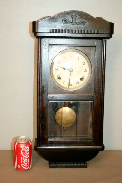A beautiful vintage mechanical wall clock with a cut glass door and spiral gong in lovely condition