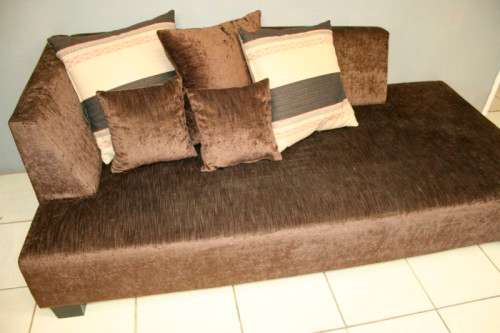 A superb modern (X-large) chocolate brown fabric couch w/ stunning cushions in exquisite condition