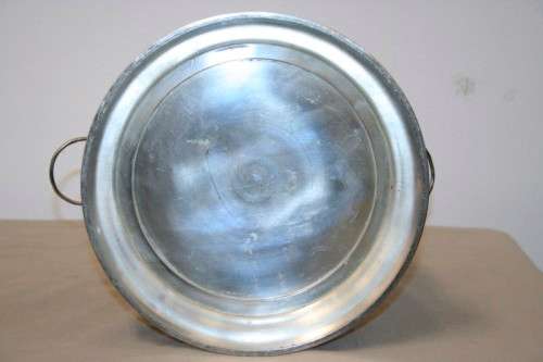 A stunning silver plated wine cooler with beautiful engraved detailing and lion-head ring handles