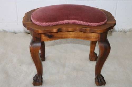 A stunning and well-made vintage ball & claw upholstered foot stool in great condition!