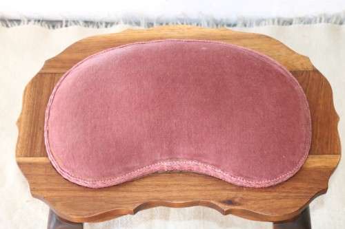 A stunning and well-made vintage ball & claw upholstered foot stool in great condition!