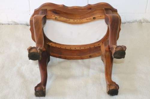 A stunning and well-made vintage ball & claw upholstered foot stool in great condition!