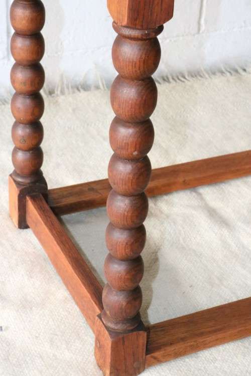 A gorgeous and stylish vintage solid Oak occasional coffee table with turned bobbin legs