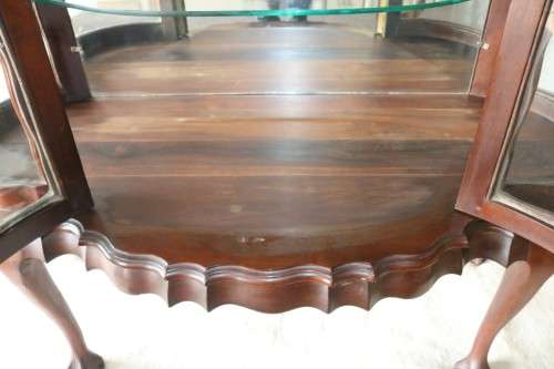 A beautiful vintage "curved glass" ball and claw display cabinet w scalloped edges & glass shelves