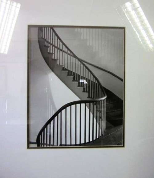 **RS17** A (large) black and white photograph of a spiral staircase in a broad-border frame