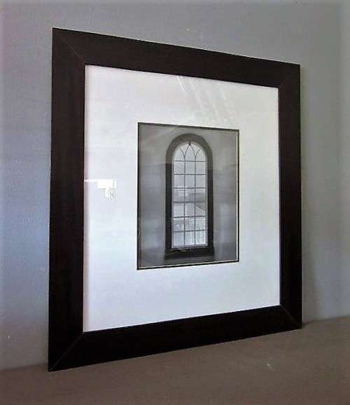 **RS17** A (large) black and white photograph of a "window" in a complimentary broad-border frame