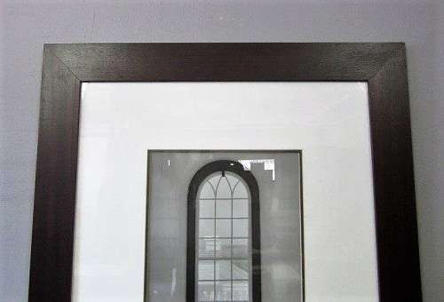 **RS17** A (large) black and white photograph of a "window" in a complimentary broad-border frame