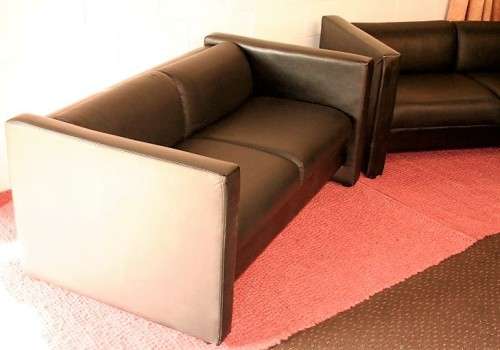 An awesome and stylish black bonded leather 2-seater "Tuxedo" couch in great condition