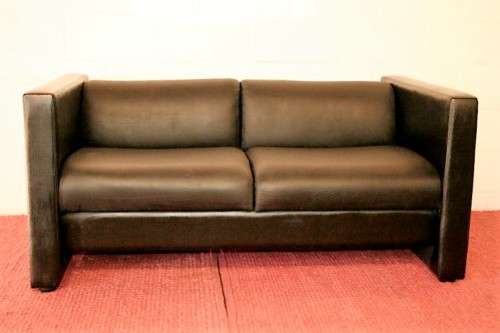 An awesome and stylish black bonded leather 2-seater "Tuxedo" couch in great condition