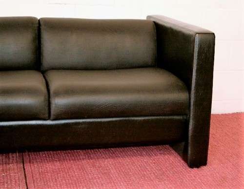 An awesome and stylish black bonded leather 2-seater "Tuxedo" couch in great condition