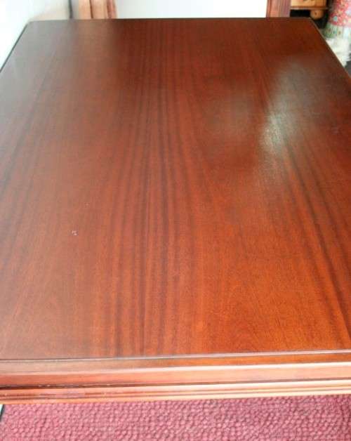 A stunning mahogany 6 to 8-seater dining table with stylish modern lines in excellent condition