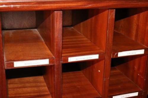 An awesome 49 bottle (floor cabinet) wine rack with individual wine bottle slots and sections