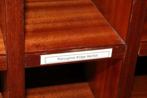 An awesome 49 bottle (floor cabinet) wine rack with individual wine bottle slots and sections
