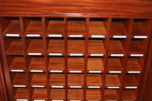 An awesome 49 bottle (floor cabinet) wine rack with individual wine bottle slots and sections