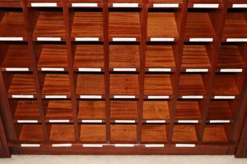 An awesome 49 bottle (floor cabinet) wine rack with individual wine bottle slots and sections