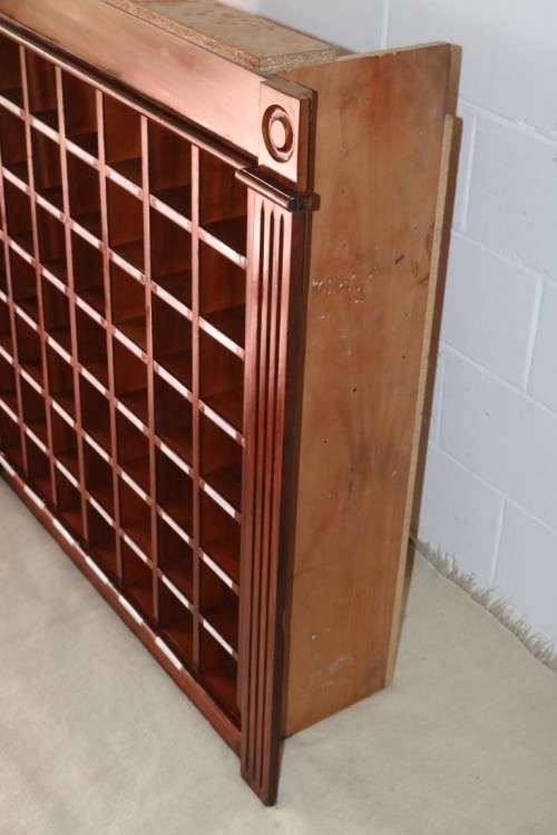An awesome 49 bottle (floor cabinet) wine rack with individual wine bottle slots and sections