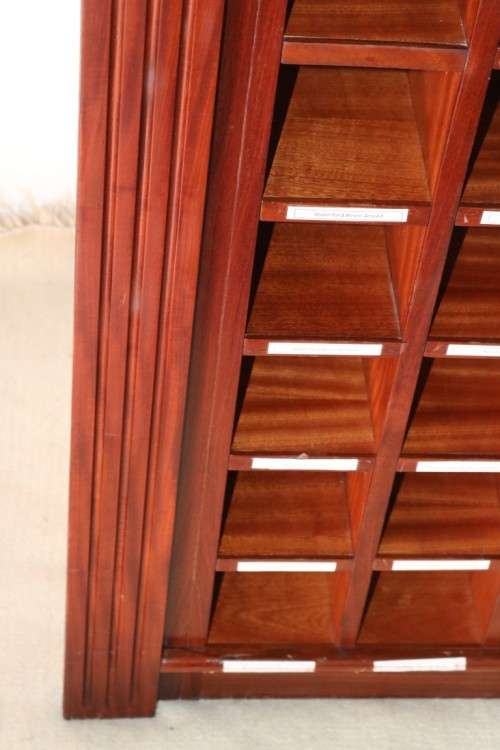 An awesome 49 bottle (floor cabinet) wine rack with individual wine bottle slots and sections