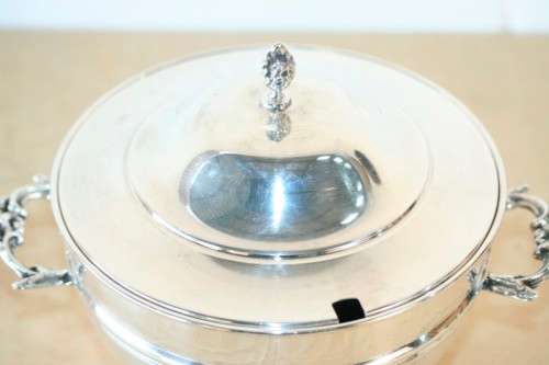 An exquisite vintage "EMESS" silver plated tureen with a slotted lid and beautiful ornate handles