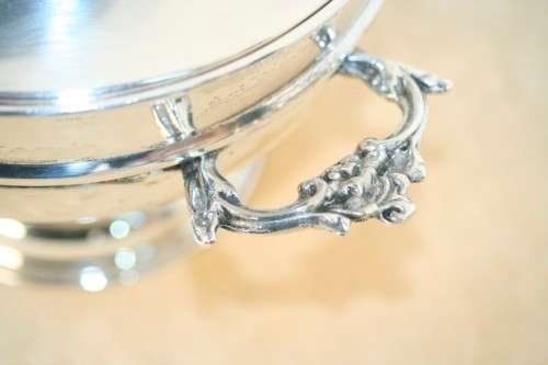 An exquisite vintage "EMESS" silver plated tureen with a slotted lid and beautiful ornate handles