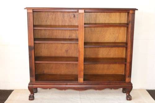 A magnificent vintage solid Imbuia ball and claw bookcase w ample shelf space - perfect for a study!
