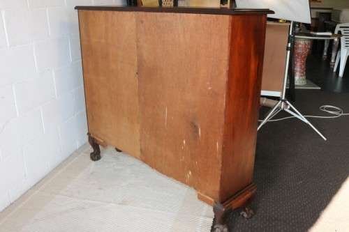 A magnificent vintage solid Imbuia ball and claw bookcase w ample shelf space - perfect for a study!