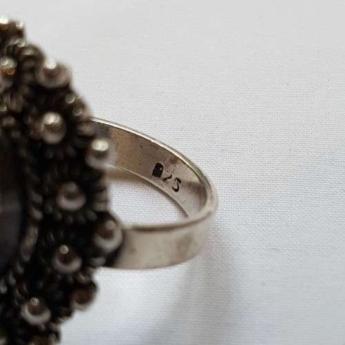 An exquisite "filigree" detailed sterling silver (925) ladies ring with a gorgeous oval moonstone