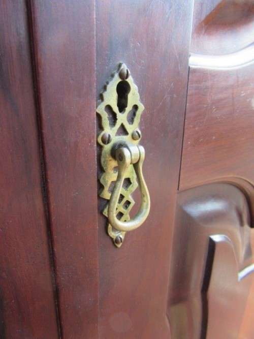 An amazing gabled double-door solid Imbuia ball & claw wardrobe w/ solid brass embellishments
