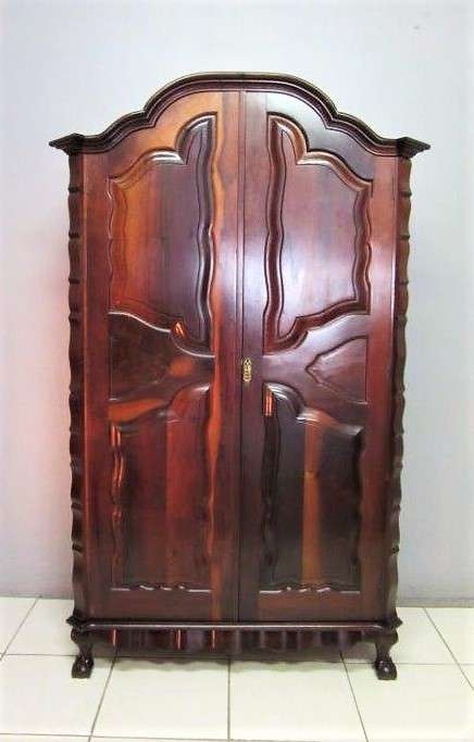 An amazing gabled double-door solid Imbuia ball & claw wardrobe w/ solid brass embellishments