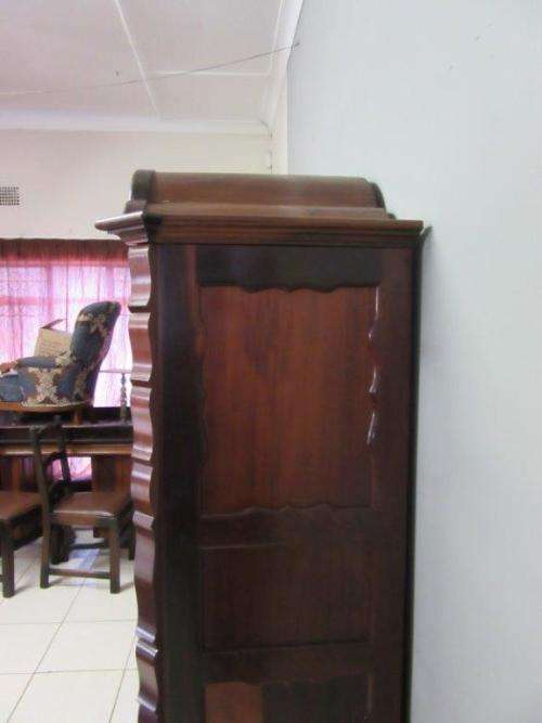 An amazing gabled double-door solid Imbuia ball & claw wardrobe w/ solid brass embellishments