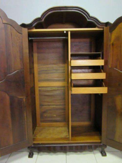 An amazing gabled double-door solid Imbuia ball & claw wardrobe w/ solid brass embellishments