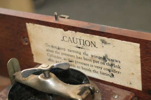 An awesome antique (c1930) "Ellams Duplicators" mimeograph in a cabinet with the original roller