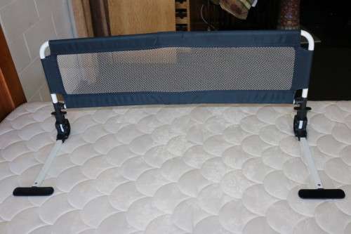 A practical and useful "Chelino Sleep Safe" toddler bed guard in good condition